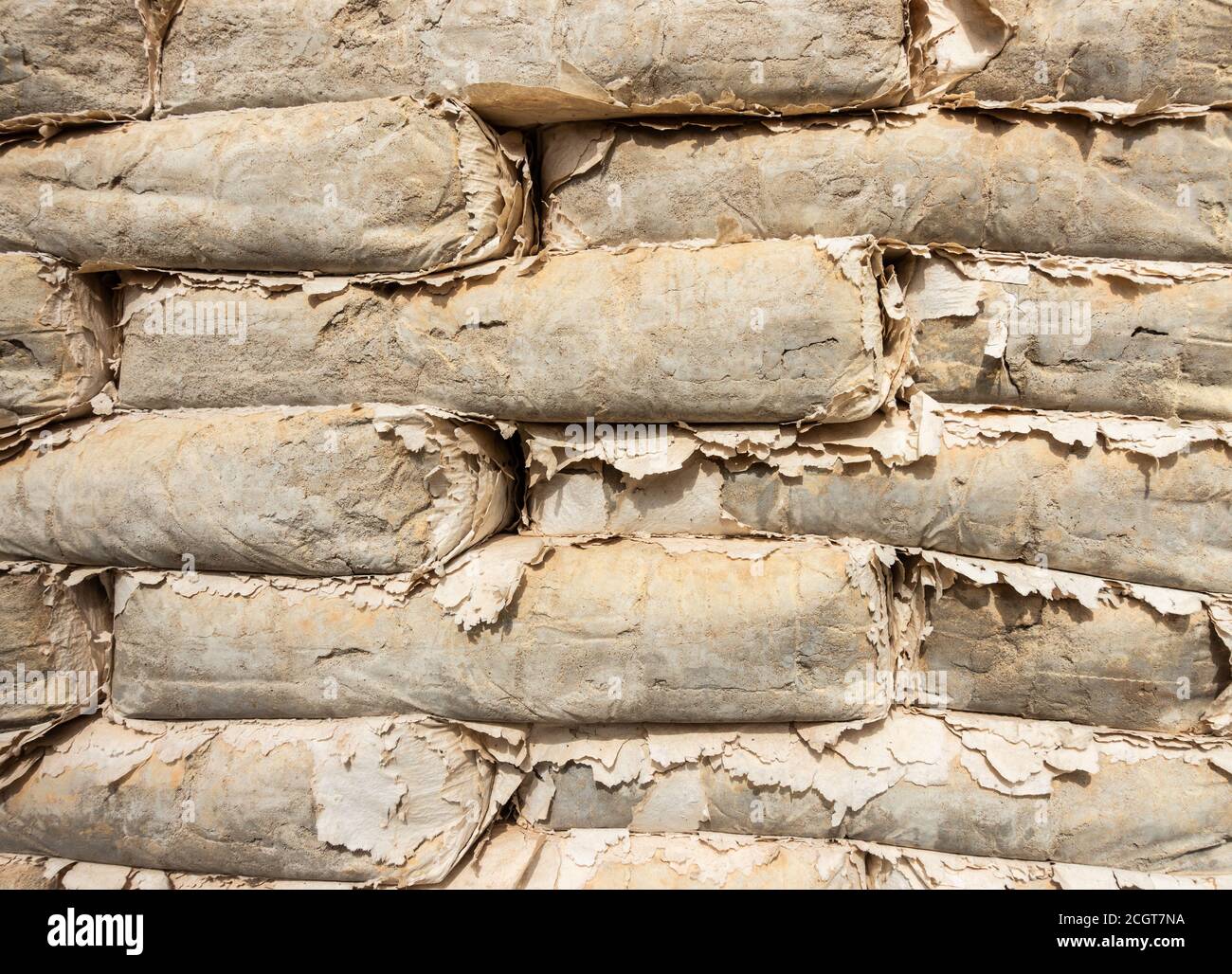 Old, unused bags of cement which have dried out in the sun on abandoned