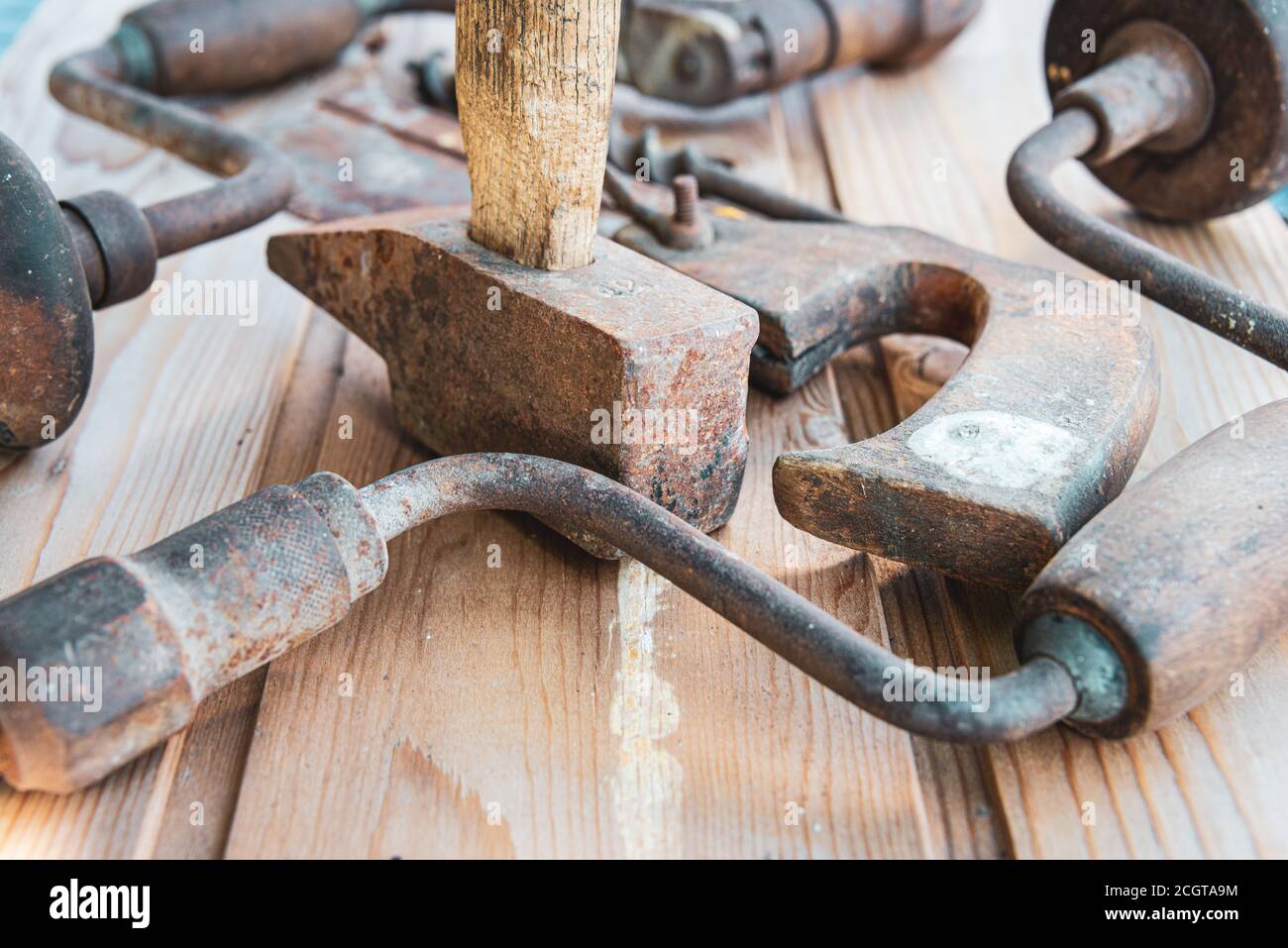 ,vintage  hand tools. on wooden table ,saw  hammer and hand drill  & bit labour day. Stock Photo