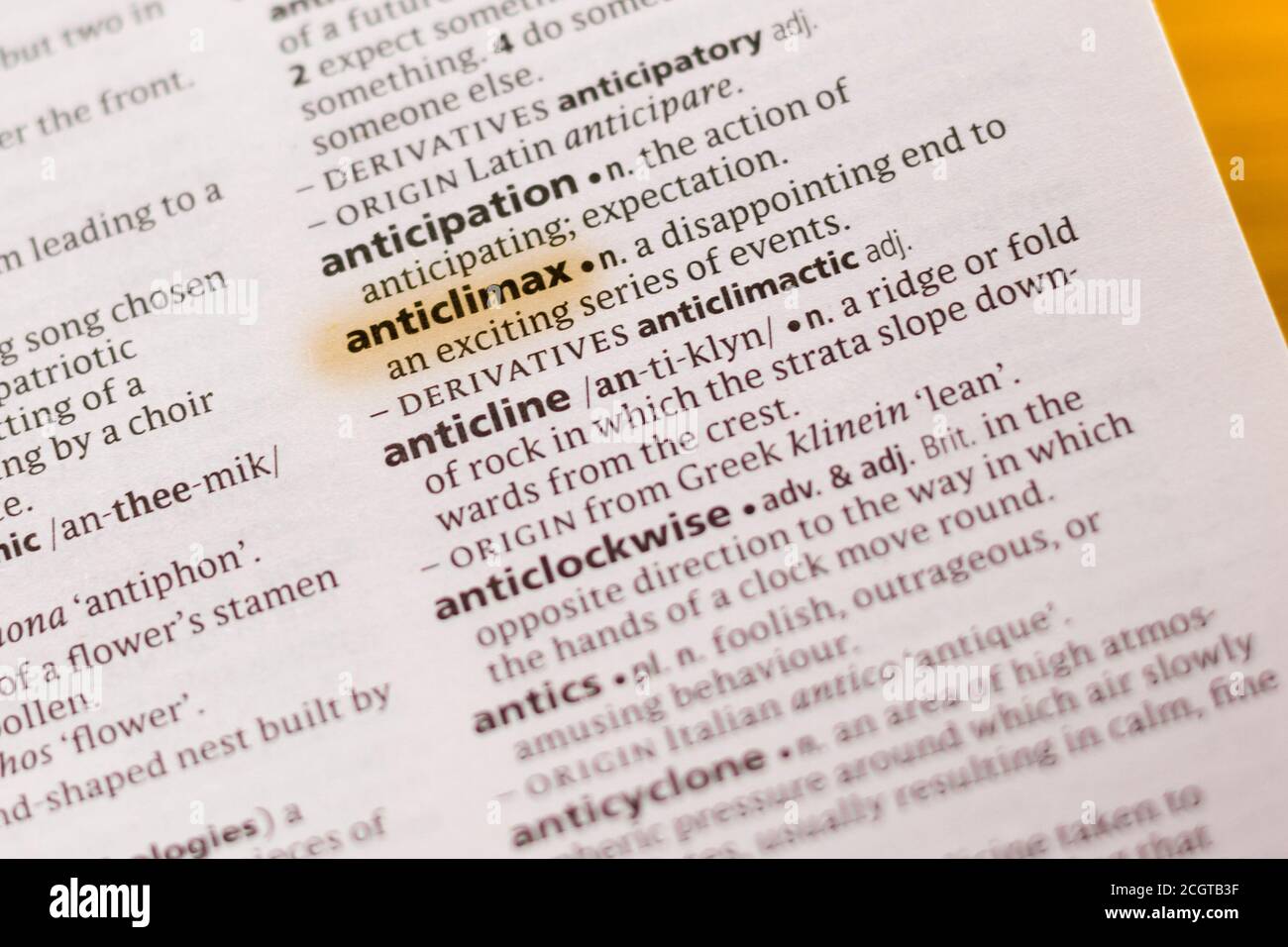 The word or phrase Anticlimax in a dictionary highlighted with marker. Stock Photo
