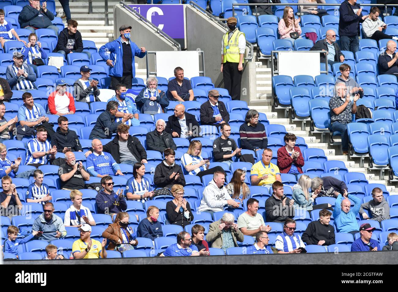 Fans during the Pre Season friendly match between Brighton and Hove Albion Chelsea at the Amex Stadium , Brighton , 29 August 2020 . The match is also being used as a test event to re-introduce fans back into live sporting events in England with 2500 supporters attending Stock Photo