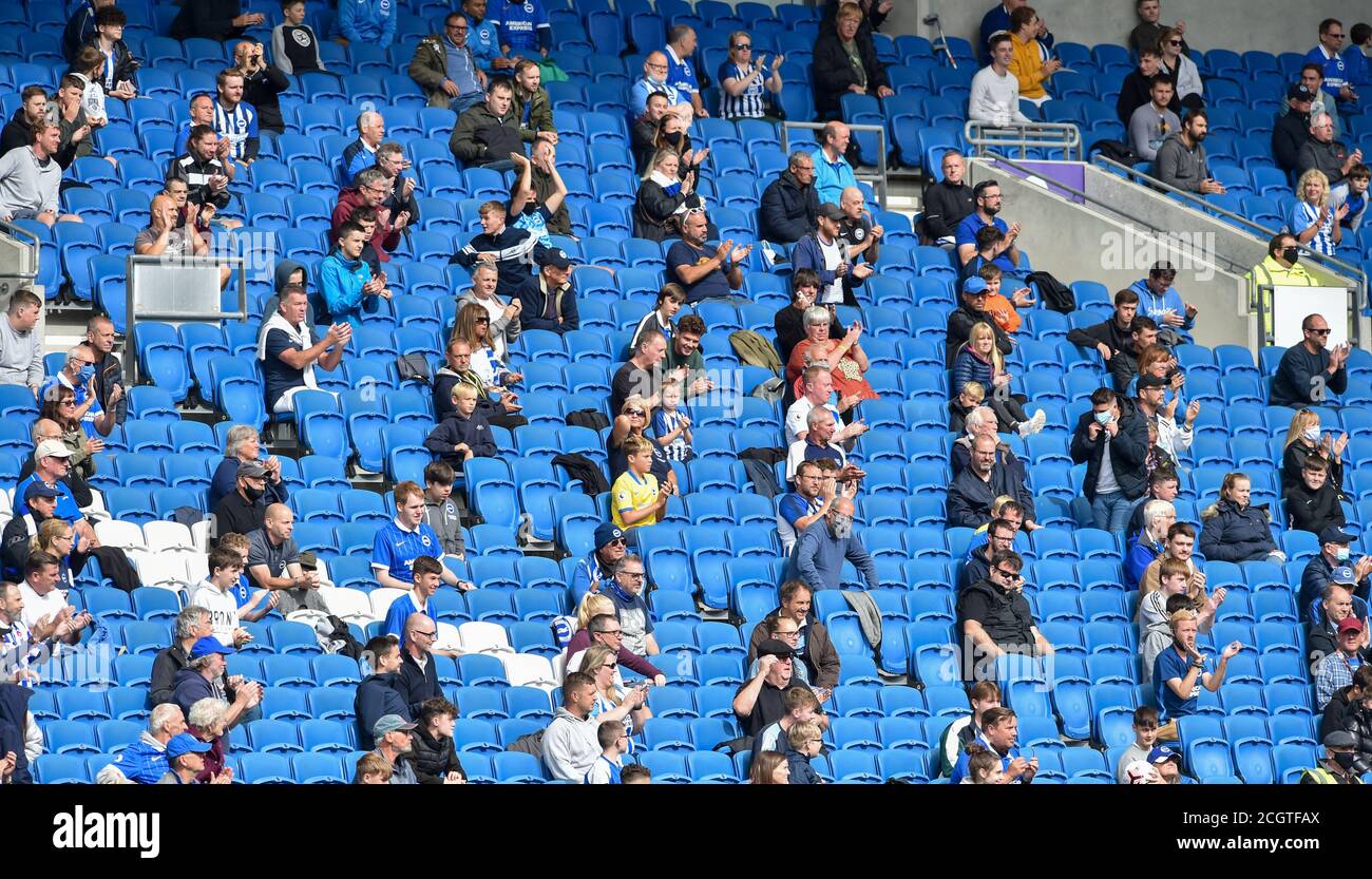 Fans watch during the Pre Season friendly match between Brighton and Hove Albion Chelsea at the Amex Stadium , Brighton , 29 August 2020 . The match is also being used as a test event to re-introduce fans back into live sporting events in England with 2500 supporters attending Stock Photo