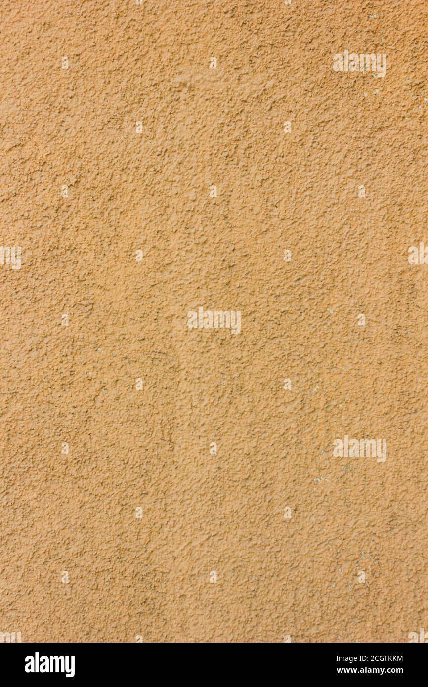 Yellow or orange concrete wall texture as a background Stock Photo