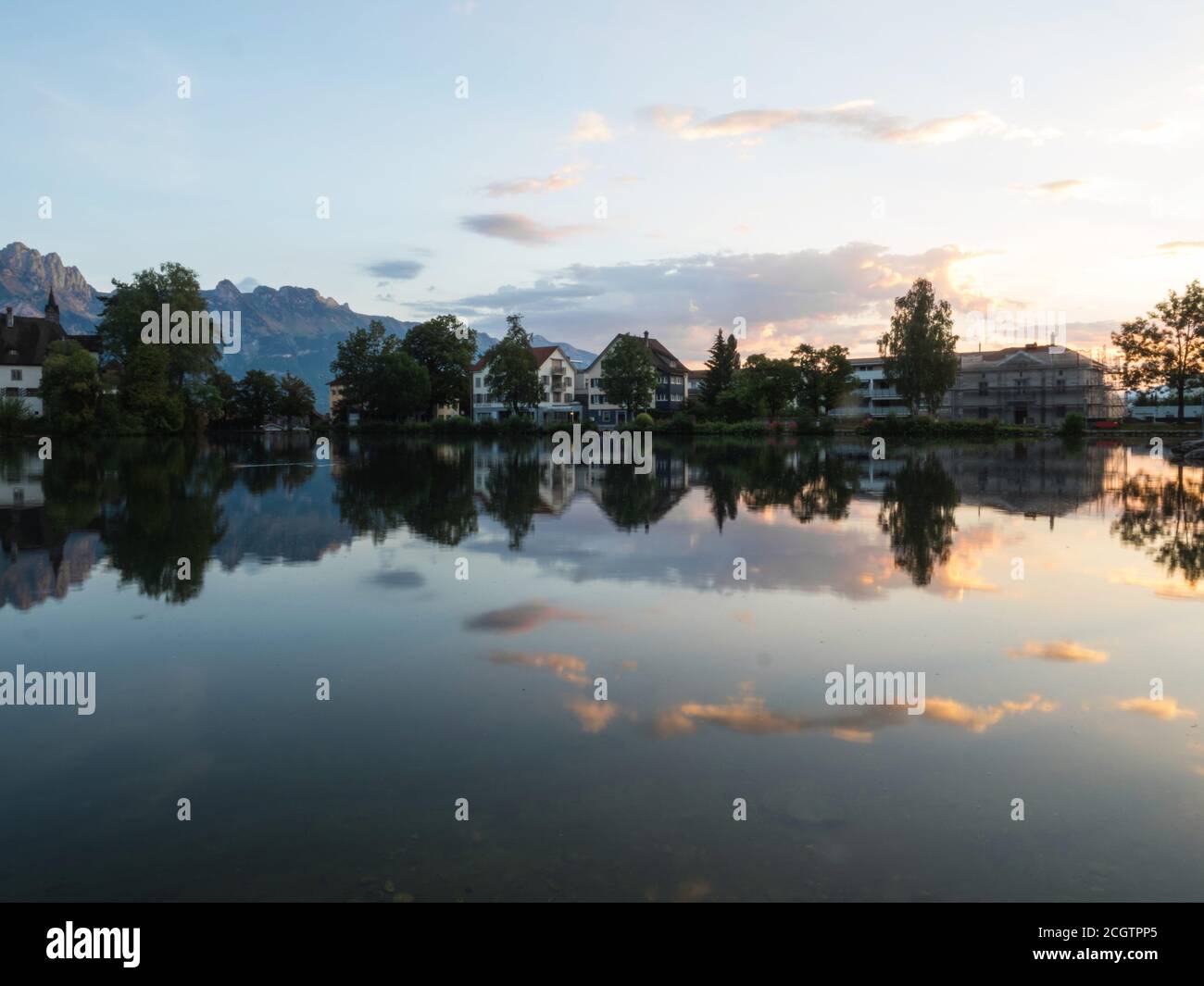 Reflection of swiss town Buchs in Werdenbergersee in St. Gallen, Switzerland Stock Photo