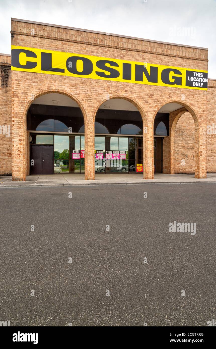 Vertical shot of an out of business store in vertical format with foreground copy space. Stock Photo