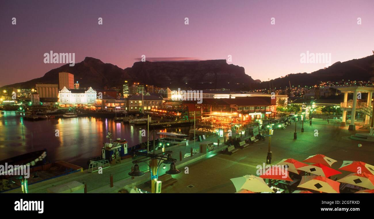 Victoria Basin in Cape Town South Africa with Table Mountain behind at dusk Stock Photo