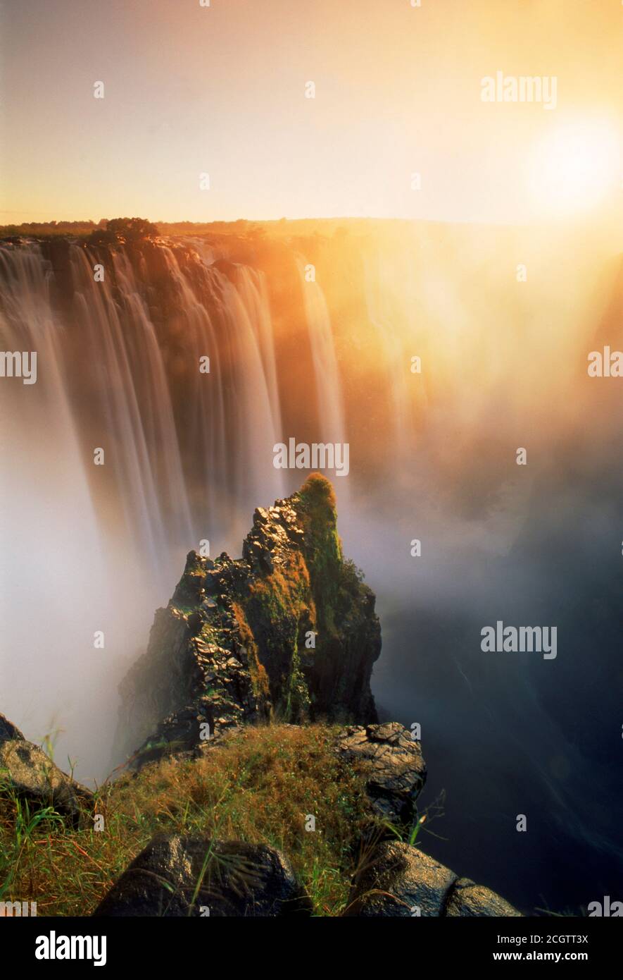 Victoria Falls from Zambia side of Zambezi River at sunrise Stock Photo