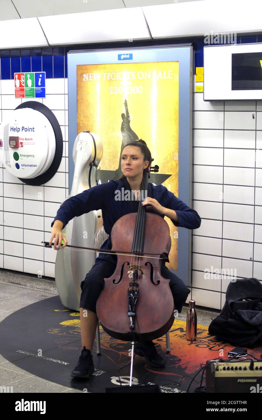 London busker cellist in Underground tube station at Piccadilly Stock Photo
