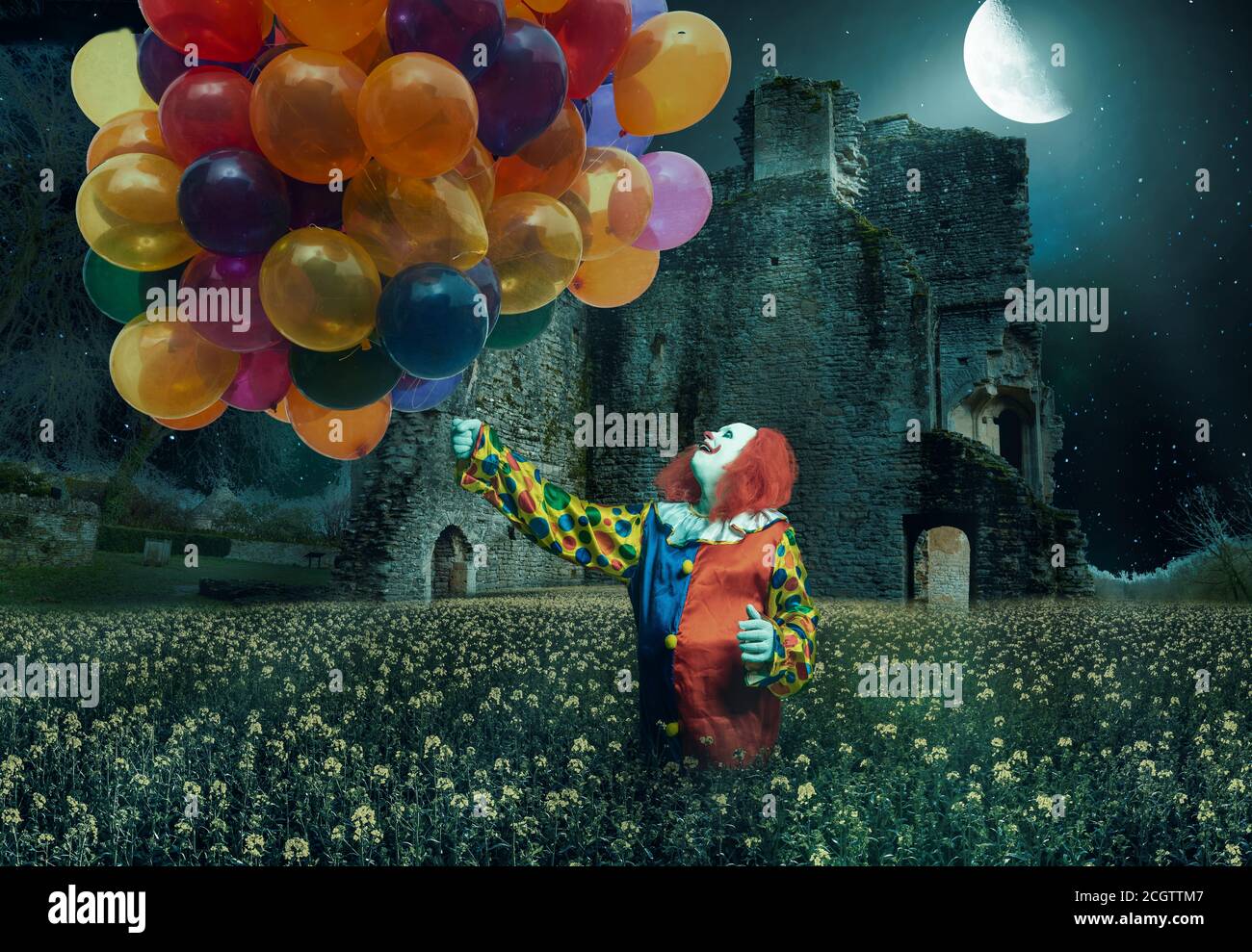a clown is holding lots of balloons against a creepy background Stock