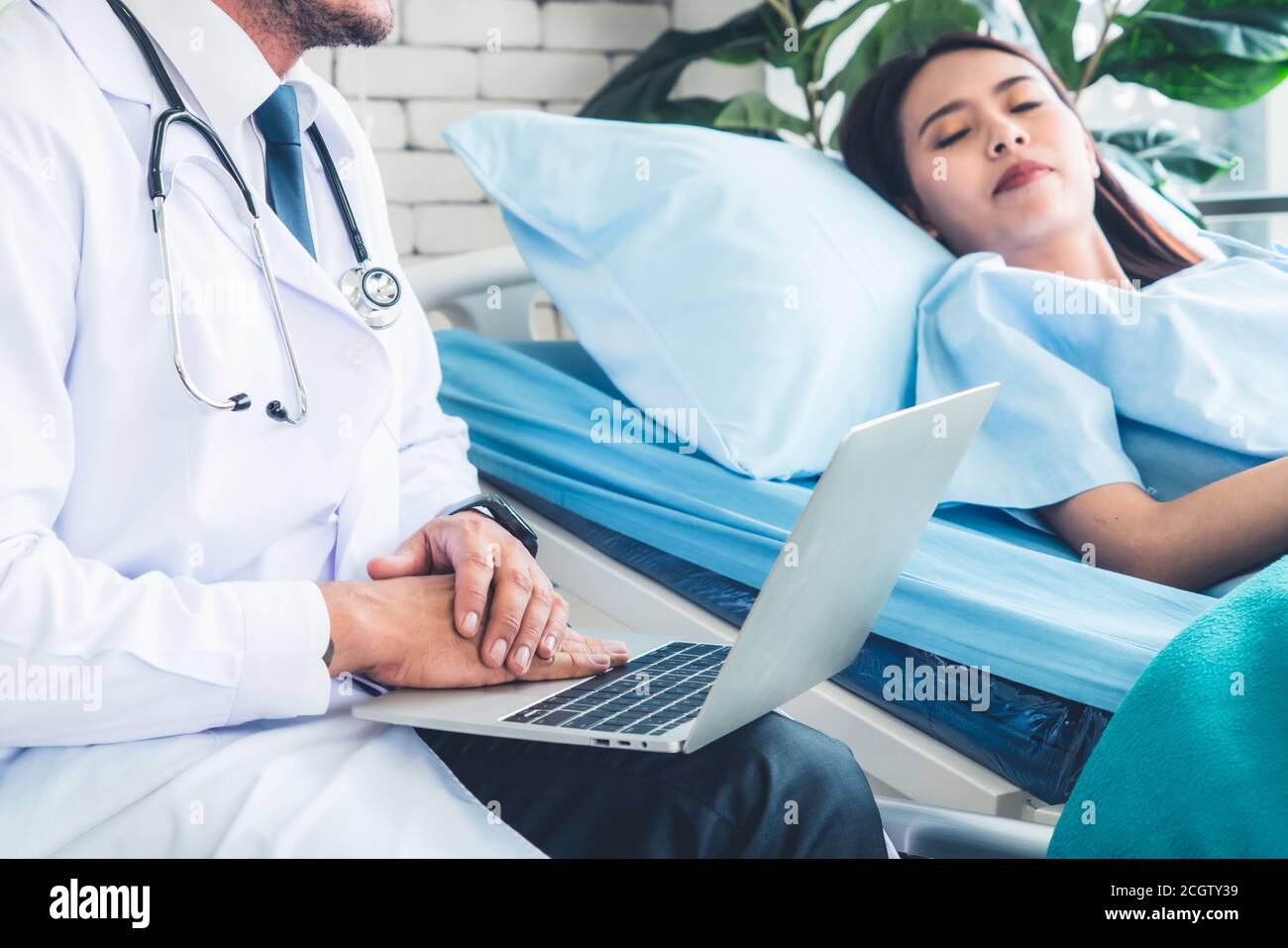 Doctor in professional uniform examining patient at hospital or medical clinic. Health care , medical and doctor staff service concept. Stock Photo