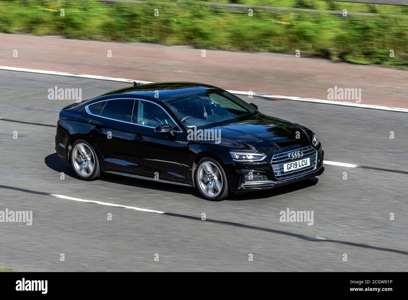 2019 black Audi A5 S Line 40 TFSI S-A; Vehicular traffic moving vehicles,  cars driving vehicle on UK roads, motors, motoring on the M6 motorway  highway network Stock Photo - Alamy