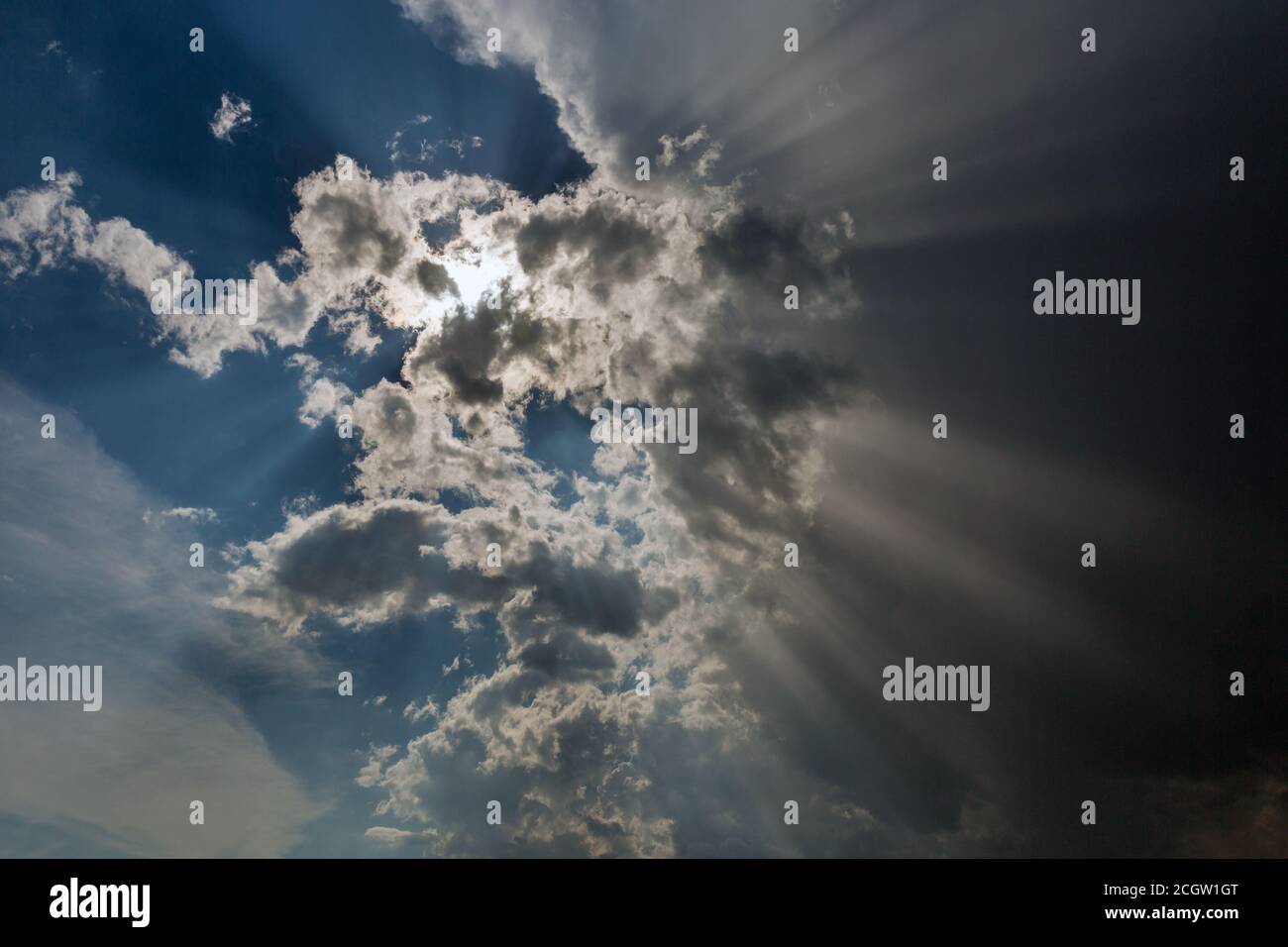 sky with cloud covers the sun rapidly, rays of light Stock Photo
