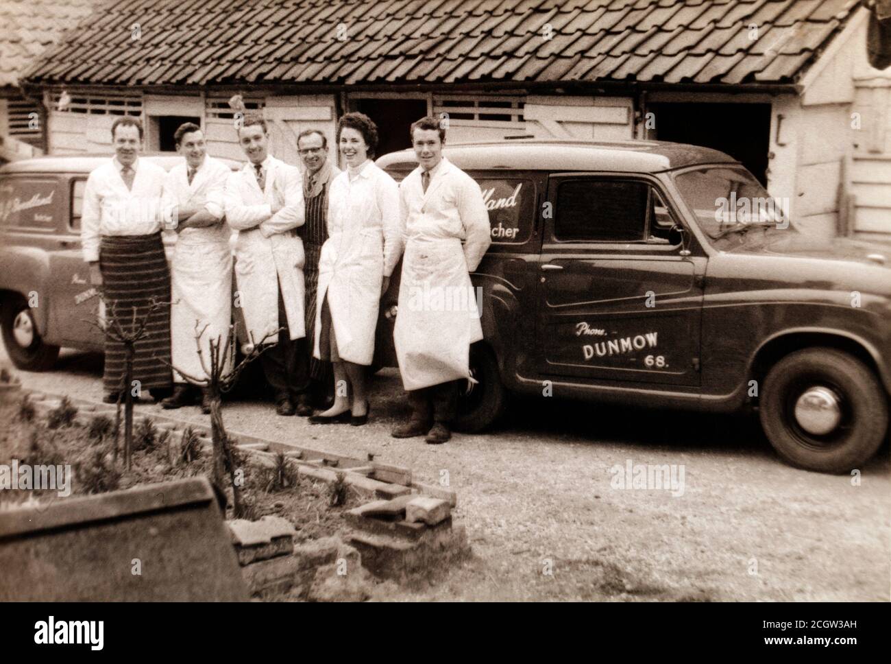 Old butchers Van with the butchers team. in the 1950's from Dunmow, the home of the Dunmow Flitch. Stock Photo