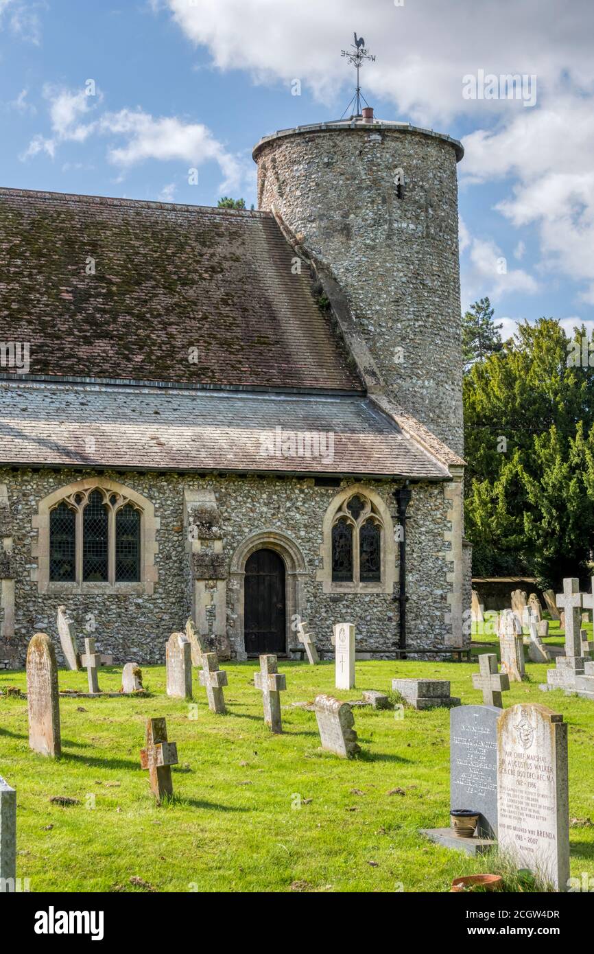 The Anglo-Saxon round towered flint church of St Mary at Burnham Deepdale on the North Norfolk coast. Stock Photo