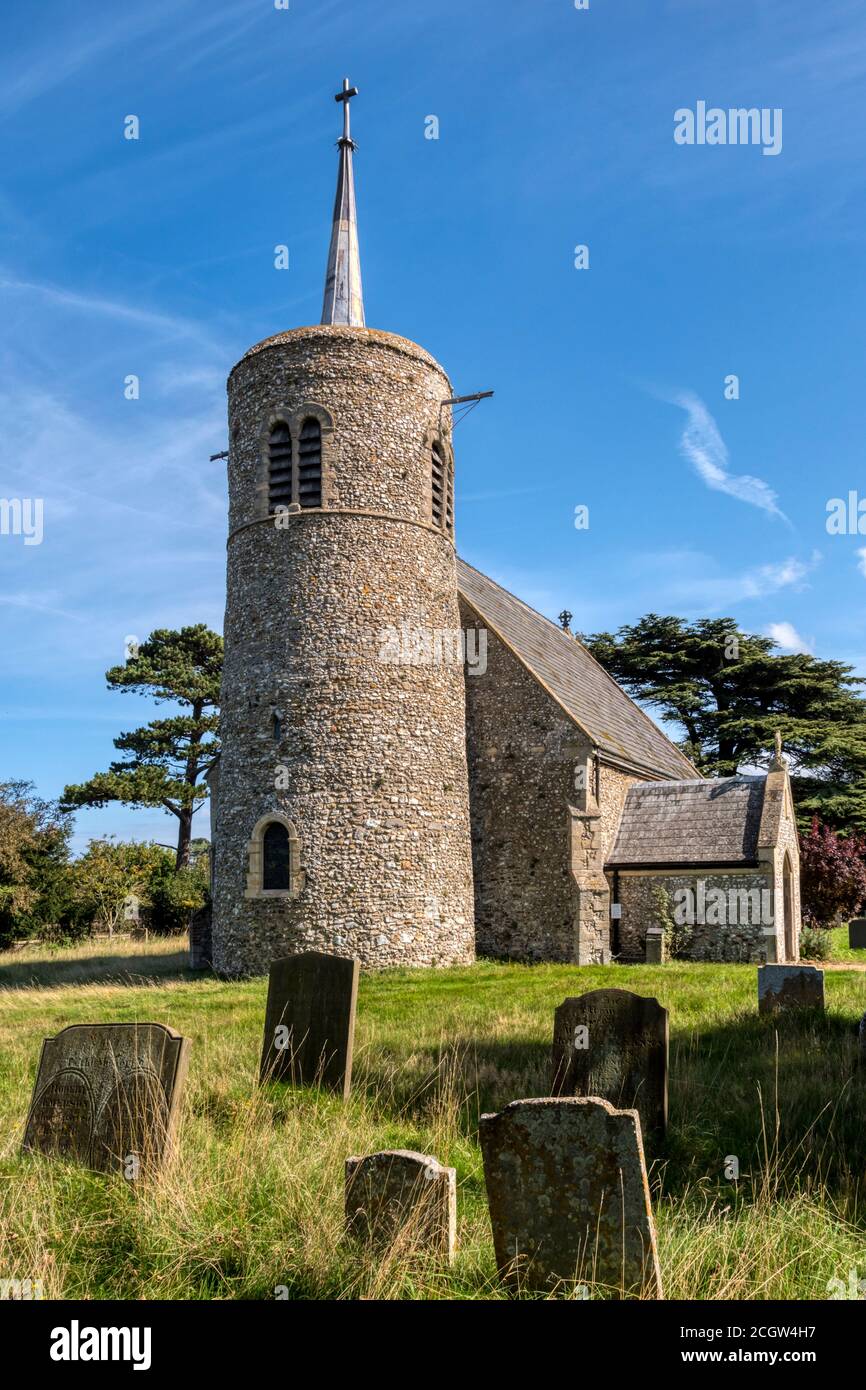 The round towered flint church of St Mary at Titchwell on the North Norfolk coast. Stock Photo