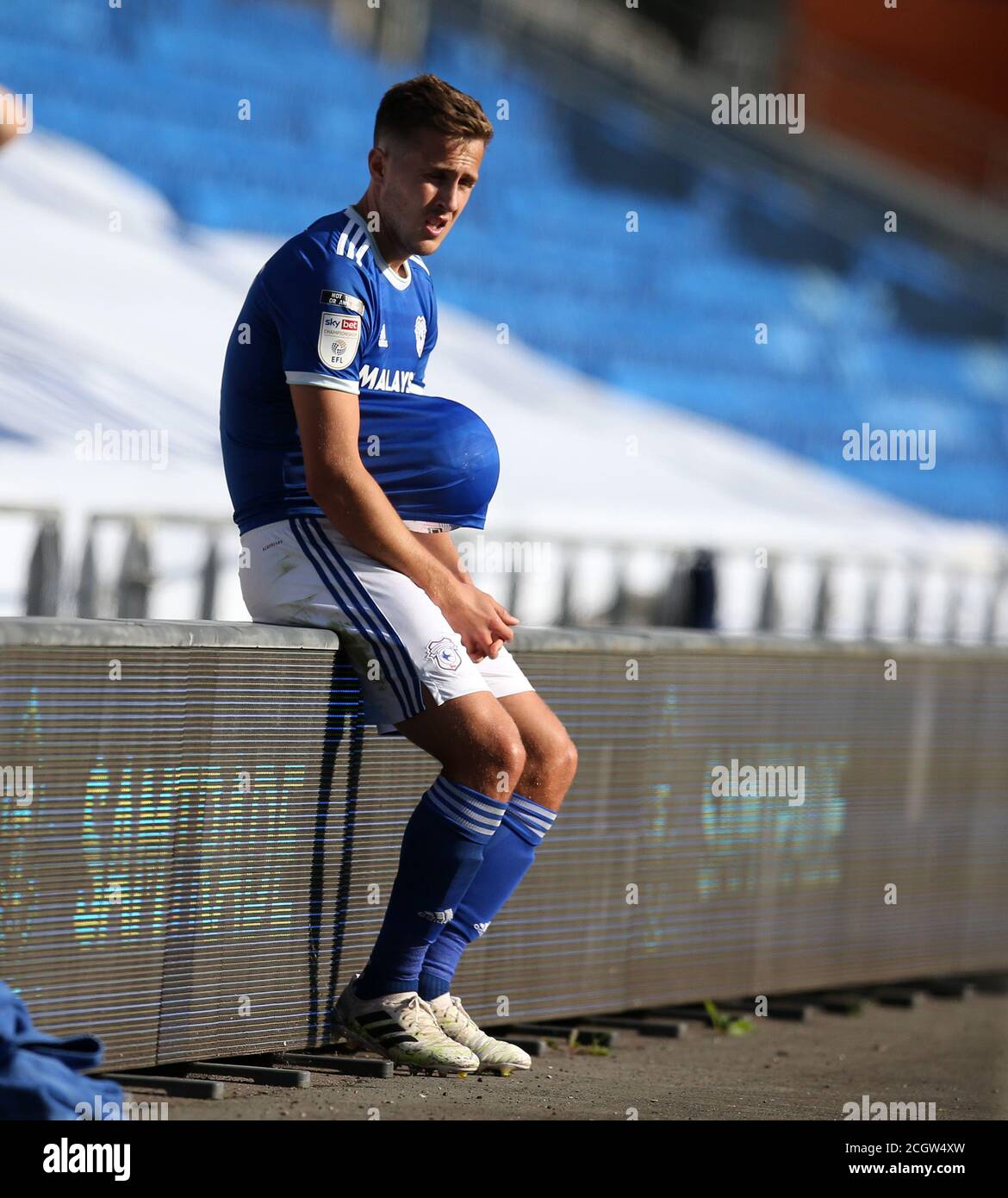 Cardiff, UK. 12th Sep, 2020. Will Vaulks of Cardiff City sits down with the ball under his shirt as he waits for play to resume. EFL Skybet championship match, Cardiff city v Sheffield Wednesday at the Cardiff City Stadium in Cardiff, Wales on Saturday 12th September 2020. this image may only be used for Editorial purposes. Editorial use only, license required for commercial use. No use in betting, games or a single club/league/player publications. pic by Andrew Orchard/Andrew Orchard sports photography/Alamy Live news Credit: Andrew Orchard sports photography/Alamy Live News Stock Photo
