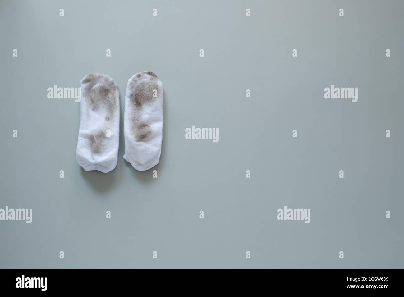 dirty socks isolated on gray background Stock Photo - Alamy