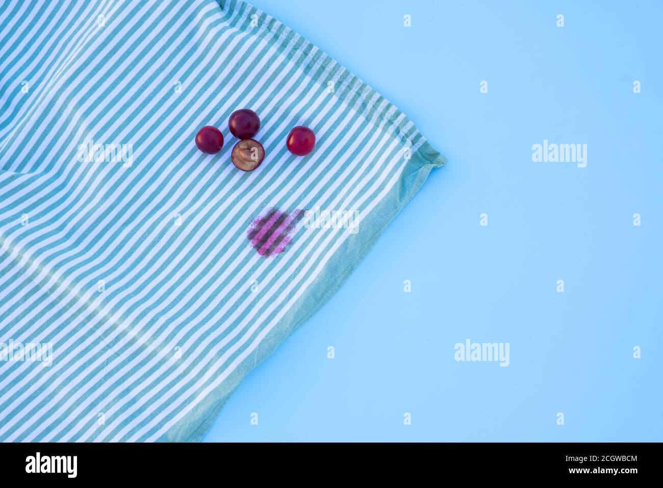dirty stains on the tablecloth. isolated on blue table.top view Stock Photo