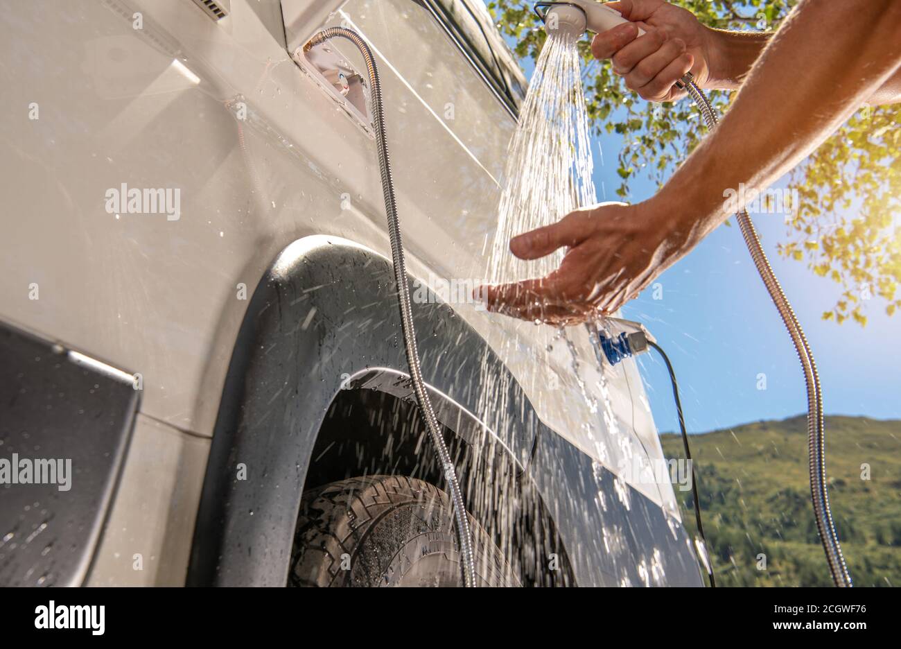 RV Camper Van Outdoor Shower Taking. Caucasian Men Preparing For Shower