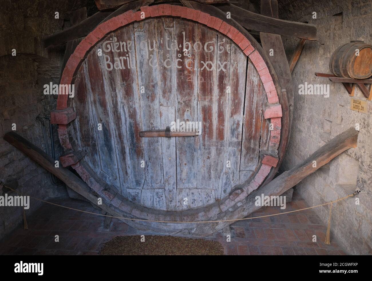 ancient giant wooden barrel produced by the friars of gubbio umbria italy Stock Photo