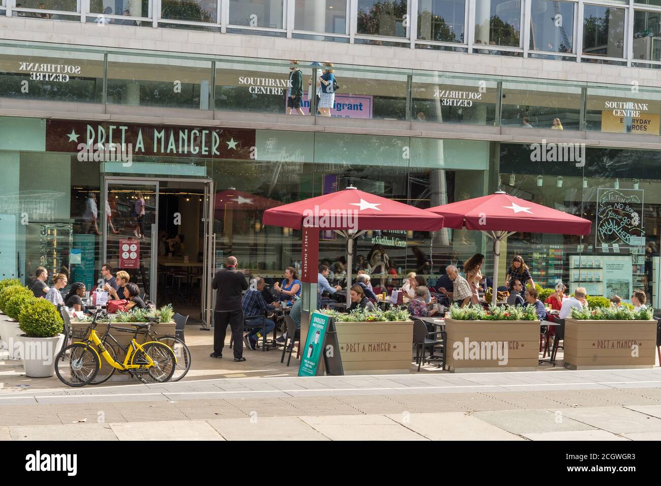 Pret a Manger on the Southbank of the River Thames on a sunny say with lots of people. London Stock Photo