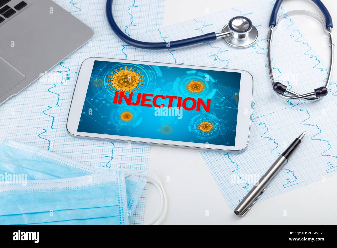 Close-up view of a tablet pc with INJECTION inscription, microbiology ...