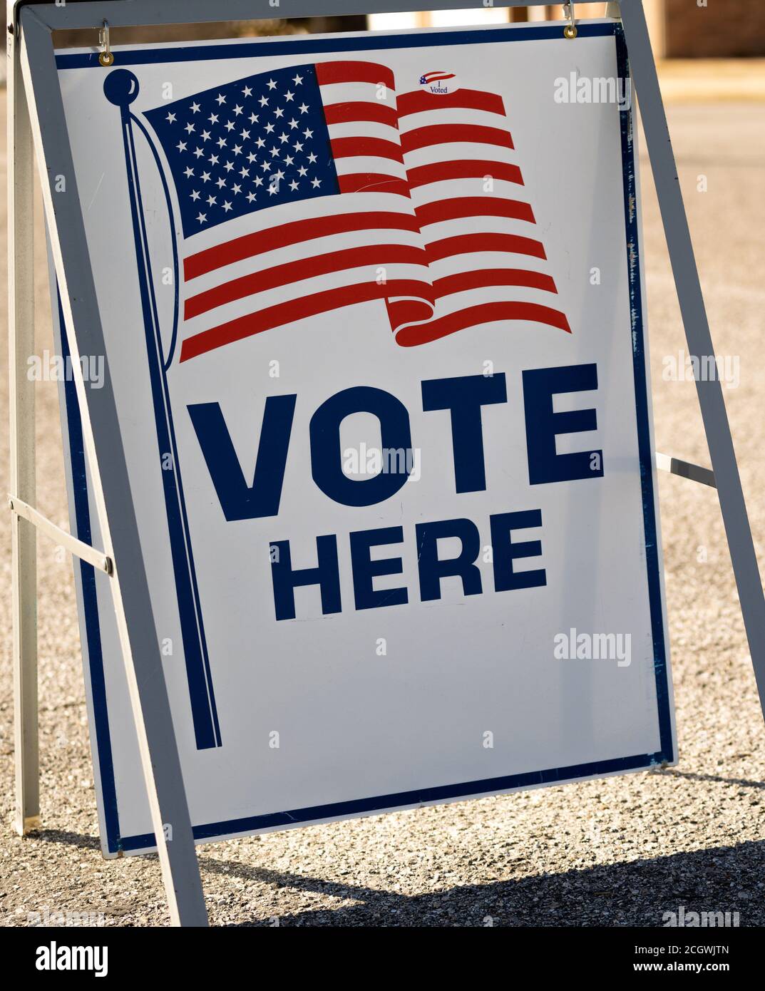 Vote Here sign in a parking lot Stock Photo