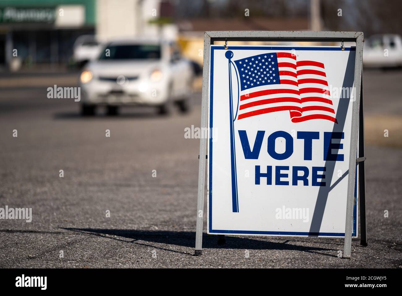 Vote Here sign in a parking lot Stock Photo