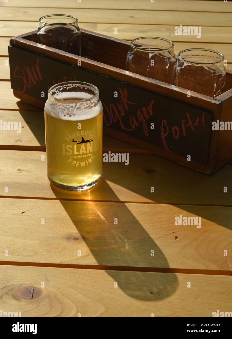A taster sized glass of craft beer from a beer flight from the brewer Vancouver Island Brewing at the brewery’s tasting room in Victoria, British Colu Stock Photo
