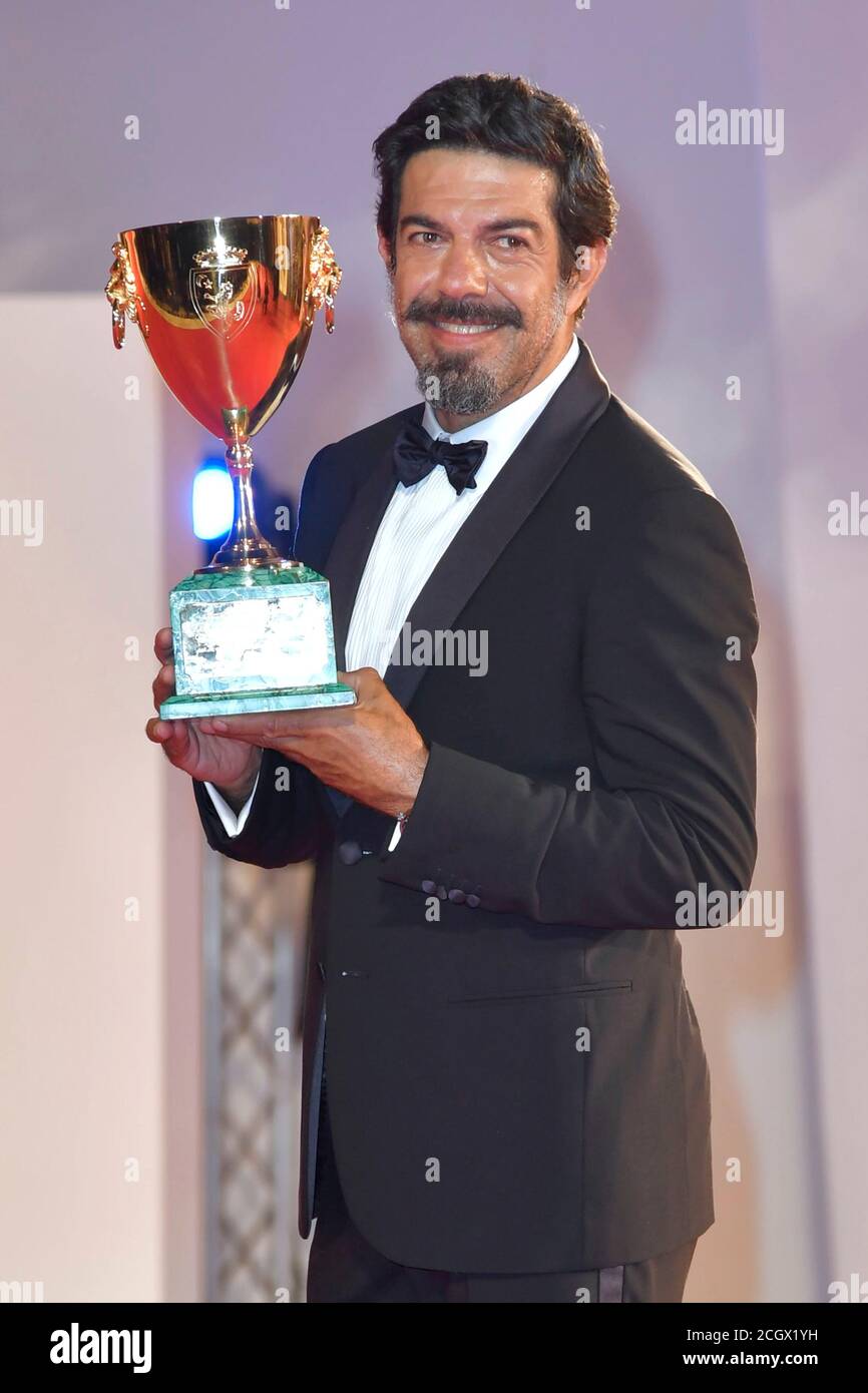 Pierfrancesco Favino posing with the Coppa Volpi for Best Actor during the Winners Carpet, 77th Venice International Film Festival, Venice, Italy, September 12, 2020. Photo by Ron Crusow/imageSPACE/MediaPunch Stock Photo