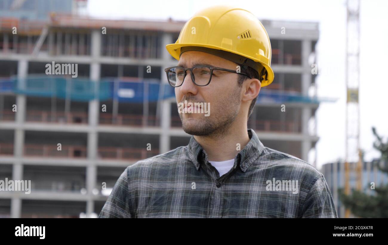 Supervisor using electronic tab on construction site. Stock Photo