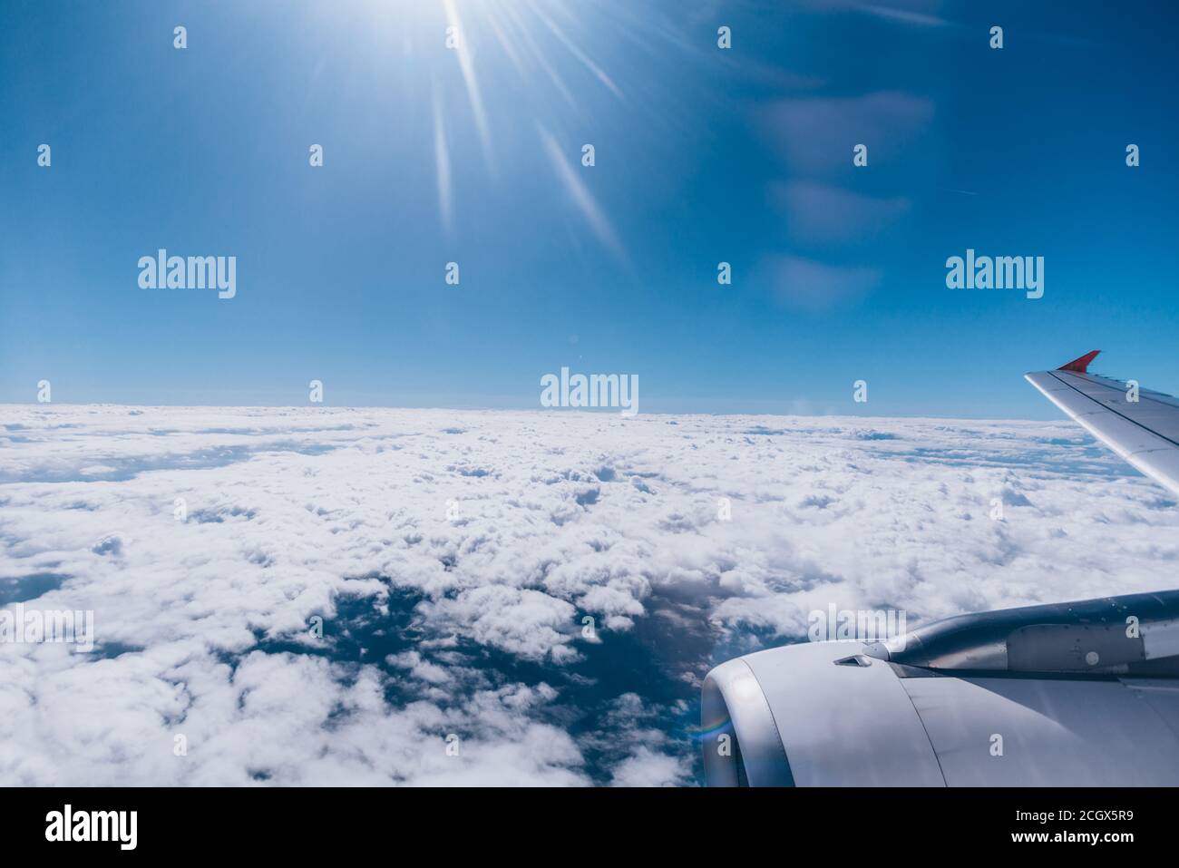 Magnificent view from above the clouds through an airplane window Stock ...
