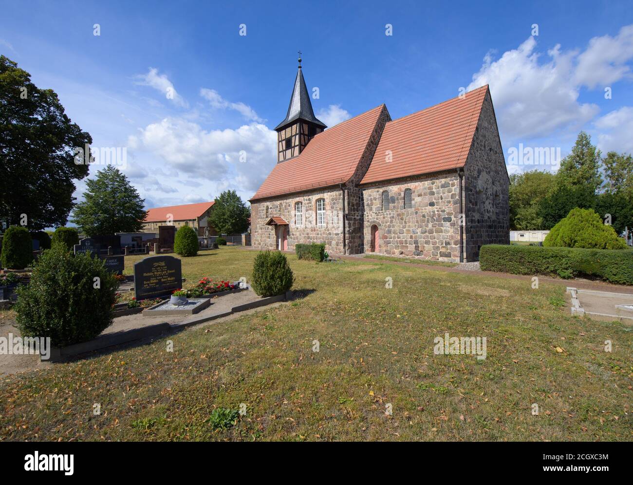 27 August 2020, Brandenburg, Trebbin/Ot Thyrow: The church in the centre of the village is a Romanesque fortified church from the 13th century. The building, which burned out during the 30-year war, was rebuilt in the 17th century and belonged to the diocese of Meissen until the Middle Ages. Afterwards the village together with the fieldstone church was sold to the bailiwick Trebbin. By the way, the first bell was cast in Magdeburg as early as 1590, but had to be recast many years later because of its impure sound. Photo: Soeren Stache/dpa-Zentralbild/ZB Stock Photo