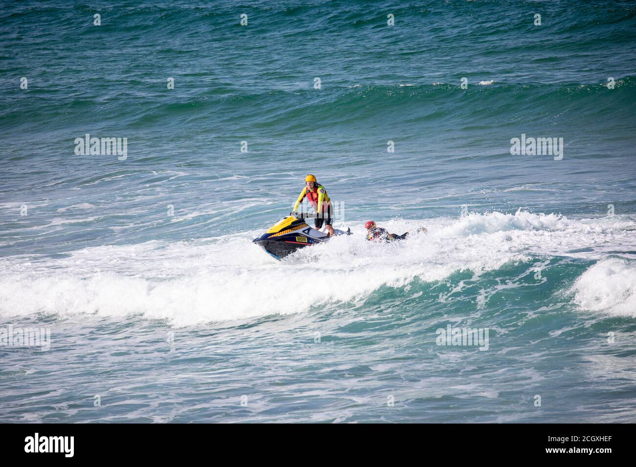 Sydney surf rescue lifeguards at Palm beach practice water manoeuvres and training on their jet ski watercraft, Sydney,NSW,Australia Stock Photo