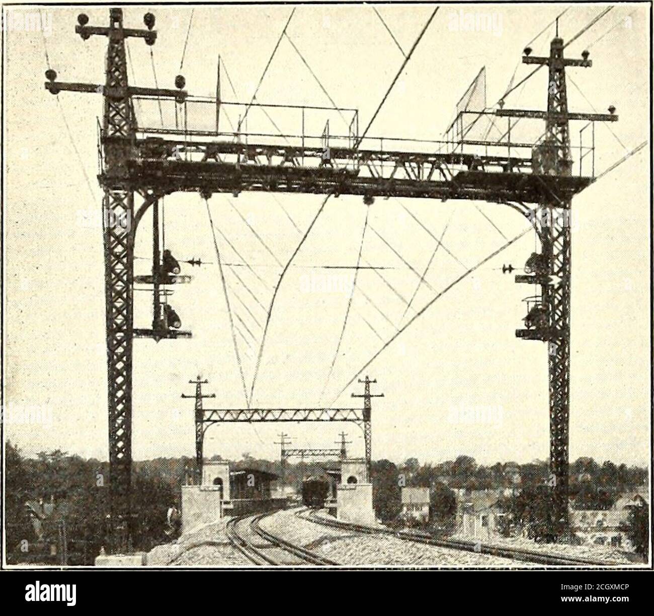 . Electric railway journal . WESTCHESTER SIGNALS—TYPICAL SEMAPHORE SIGNALS ONCATENARY BRIDGE FOR DOUBLE TRACK ers, each consisting of a 37-kw single-phase generator,mounted on the same shaft and driven by a three-phaseinduction motor. Organization Altogether there are 110 semaphore signals on theline and these, together with the four interlocking plantsthat are in continuous operation, are kept up by a forceof ten maintainers. The signal organization is headedby F. Zogbaum, engineer of maintenance New York,Westchester & Boston Railway, who has general super-vision of the track overhead lines, Stock Photo