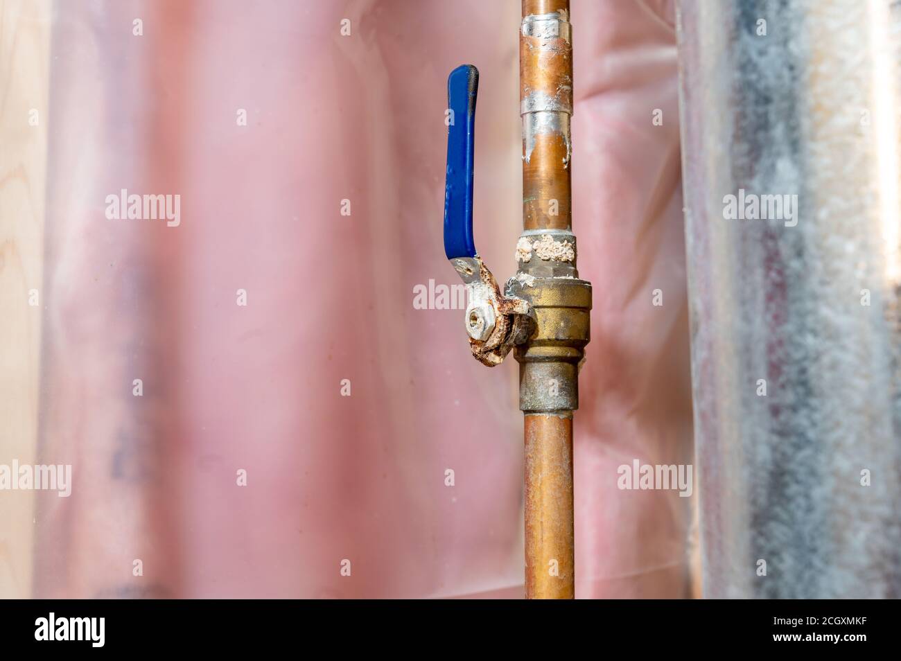 hot water line with a ball valve heavily rusted and damaged Stock Photo Alamy