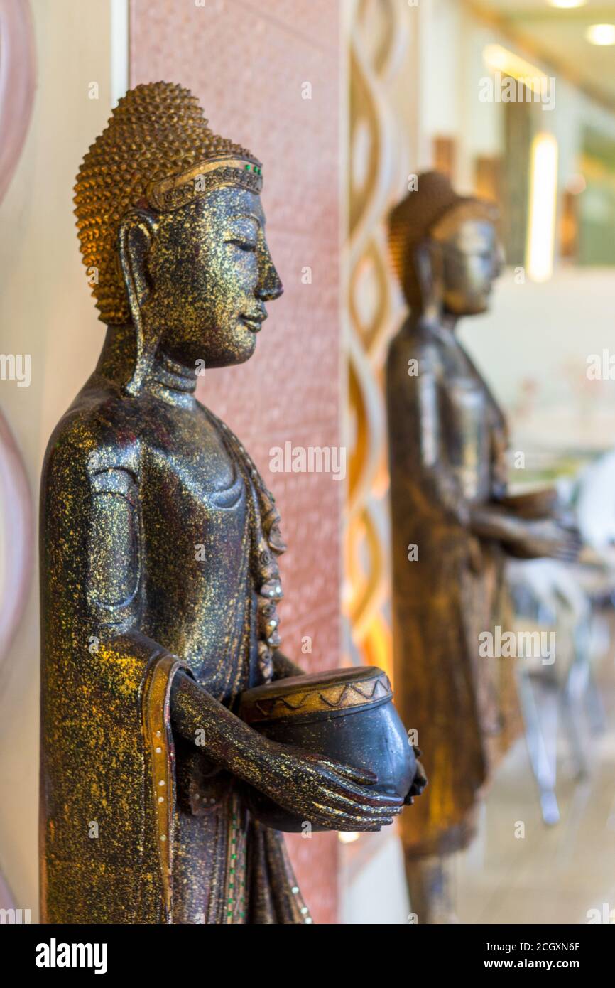 Asian statues at a vietnamese restaurant entrance Stock Photo