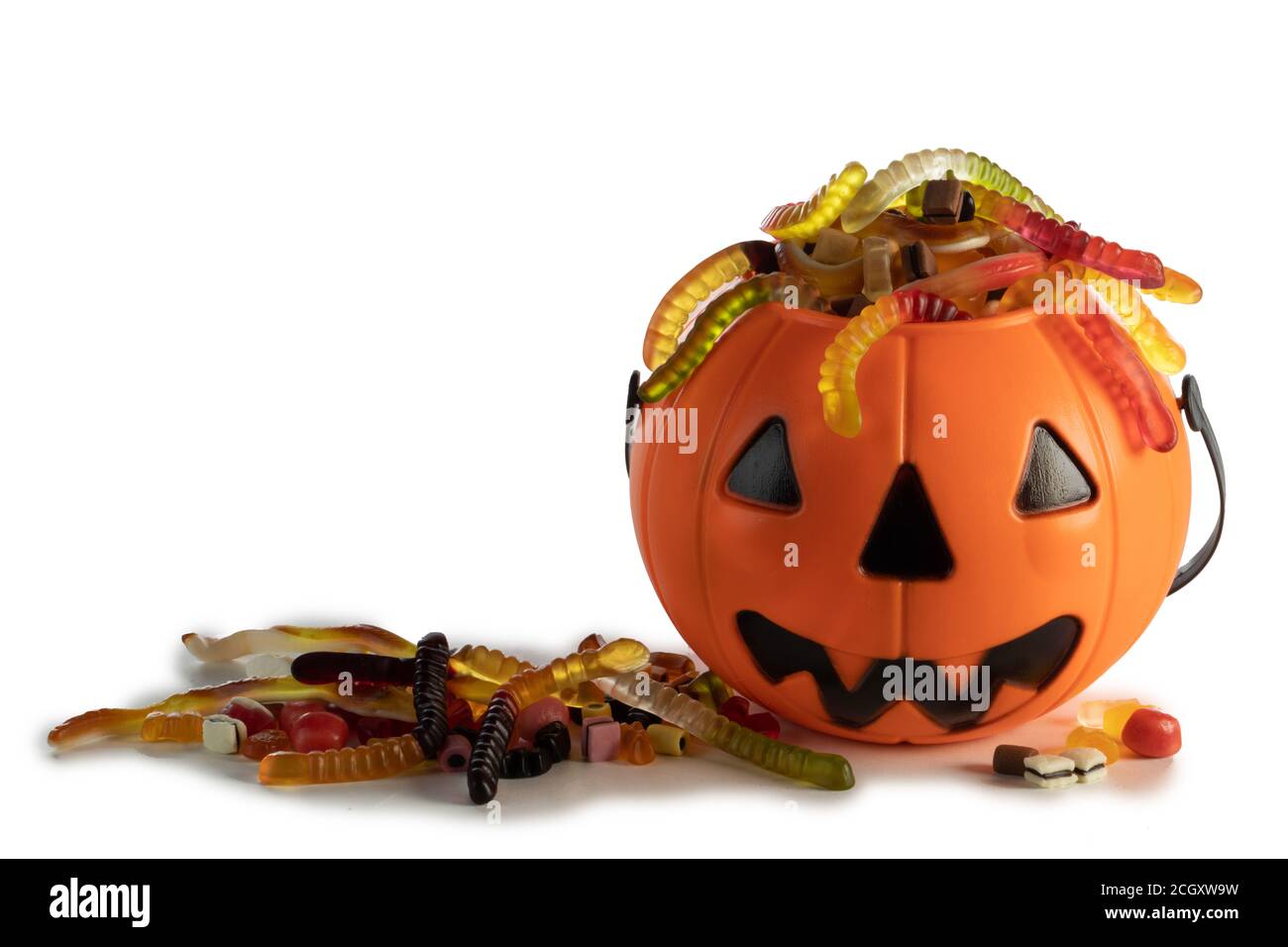 Halloween Jack o Lantern candy collector with worm candy isolated on