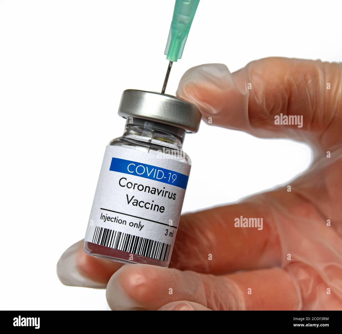 Coronavirus vaccine vial. Vaccine tested in research laboratory. Vaccine in phial in researcher's hand on white background. Close-up view. Stock Photo