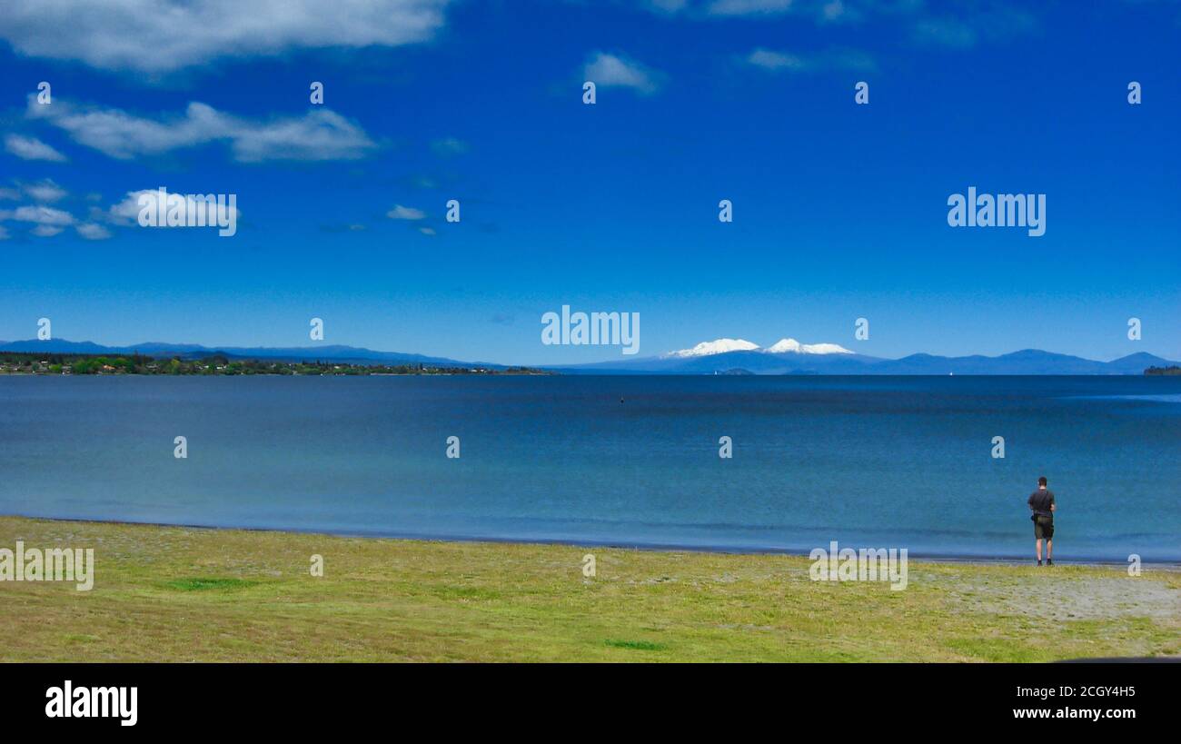 The scenery view of Tongariro national park view from lake Taupo the largest fresh water lake in New Zealand. Stock Photo