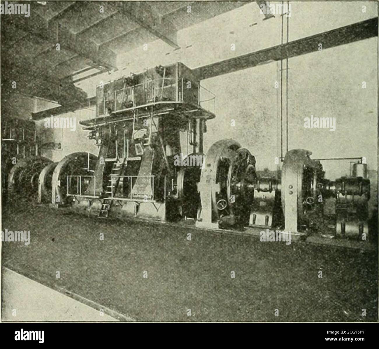 . The street railway review . Fir,. 1—100-IX. MAGNETIC CLI:TCH. 3,000 h. p. at 150 r. p. m. This is one of three clutches now inuse connecting the engines and generators in the central stationof the Imperial Electric Light, Heat & Power Co., at St. Louis, aview of the equipment of which is shown in Fig. 2. The experiencewith this plant demonstrates that this form of clutch is applicableto the large size units now being installed for power station pur-poses, whereas the ordinary friction clutch becomes unwieldy andunsightly after passing the 500-h. p. size.. IK;. 2-PL.NT of IMlERIAI^ EI,ECTRIC Stock Photo