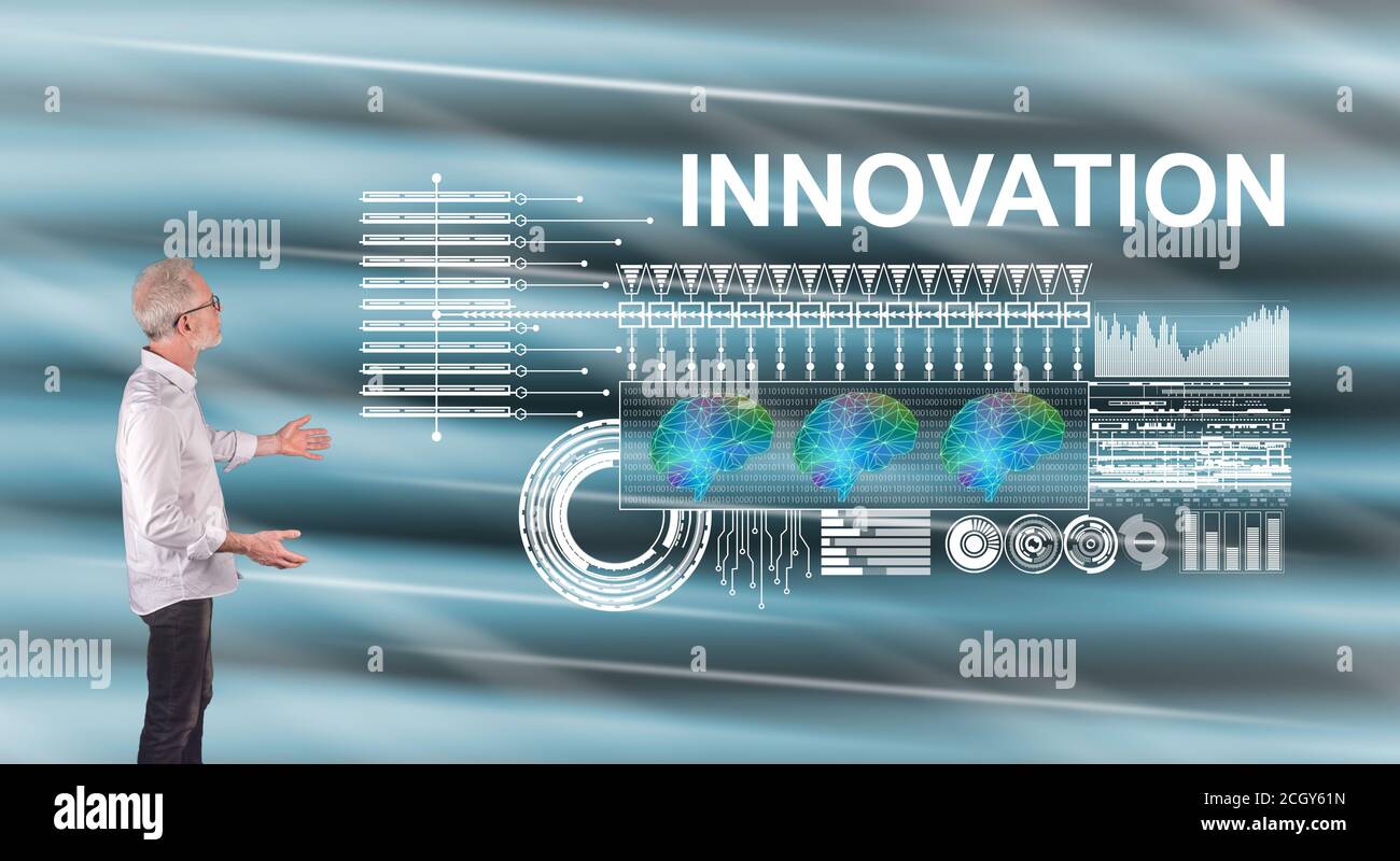 Businessman showing an innovation concept on a wall screen Stock Photo ...