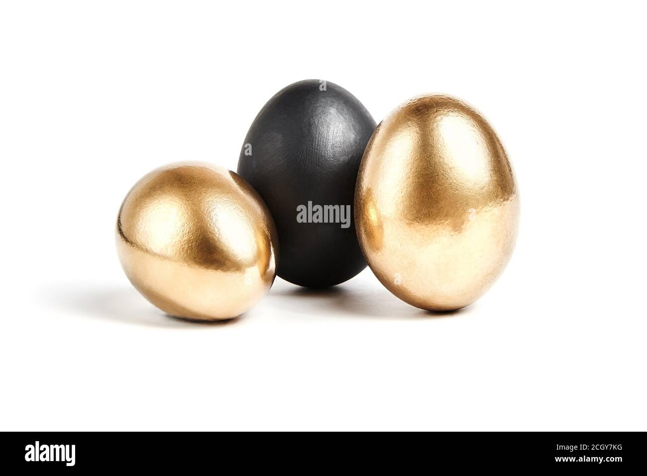 Black and two golden eggs. Business concept: risky transaction or unreliable partner, success and failure Stock Photo