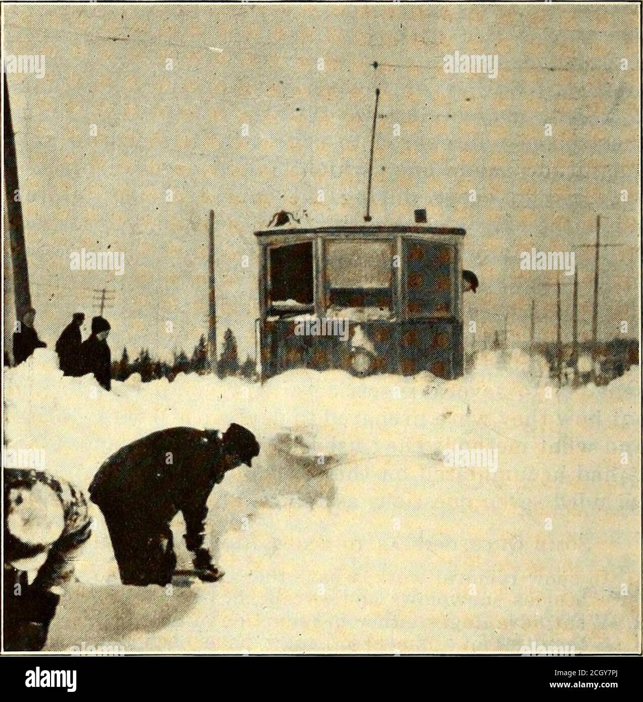 . Electric railway journal . the disposal of snow, and this method results in^uch shorter hauls. In some cases manholes are .4 iuS^ I^JIk ^ truck has its own route to cover. About twenty saltboxes are distributed at principal locations about thecity where there is a large amount of special work.The railway company has a private telephone dispatch-ing system operated from a central office in the mainoffice building with a telephone at the end of each carline and at other principal locations. This has provedinvaluable in carrying out the snow-fighting program. Chicago Has Immense Wing Plow Prope Stock Photo