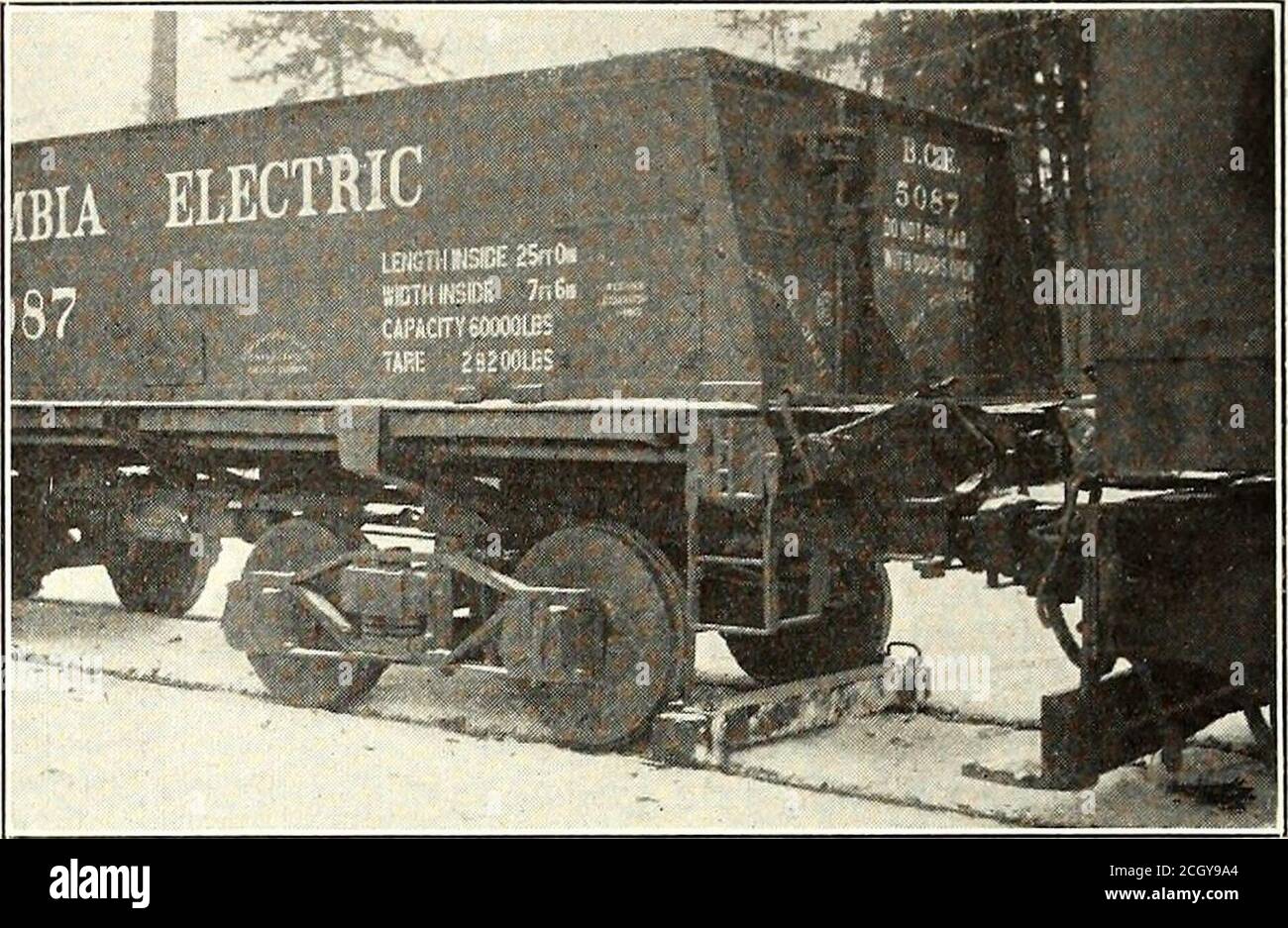 . Electric railway journal . ownthe hill by a locomotive, but even so it was believed thatoperation would not be safe because of the possibilityof skidding with locked wheels. It was first proposed,therefore, to install at the top of the hill a motor-drivenhoist which would be braked so that a cable to the rearend of a descending train would retard the speed as much as desired. But this arrangement would havebeen expensive, and, moreover, the municipality ofBurnaby was strongly opposed to allowing a cable to beoperated down the center line of a street. The mechanical department of the railway Stock Photo