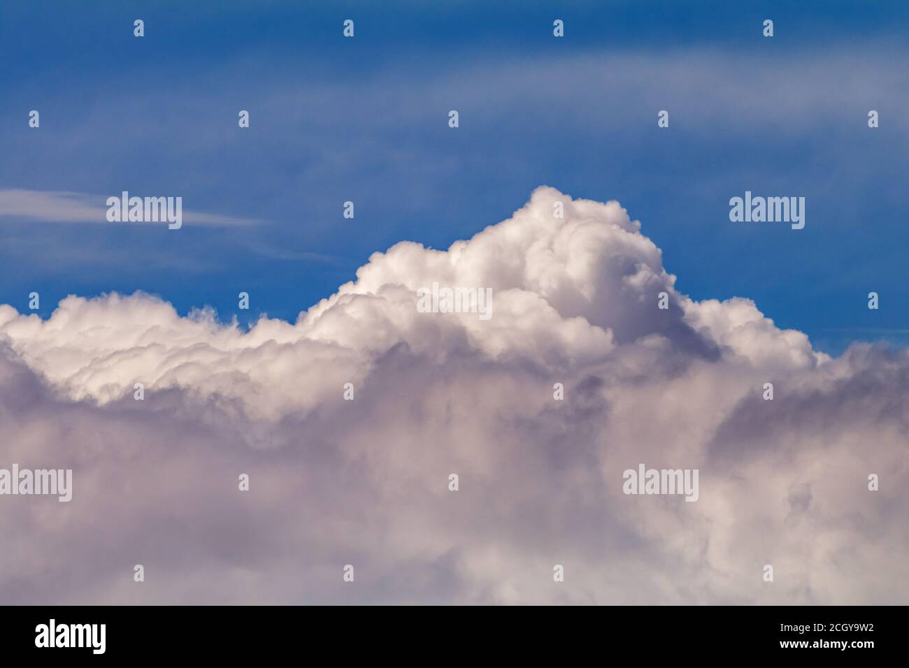 Cumulus cloud against a blue sky Stock Photo