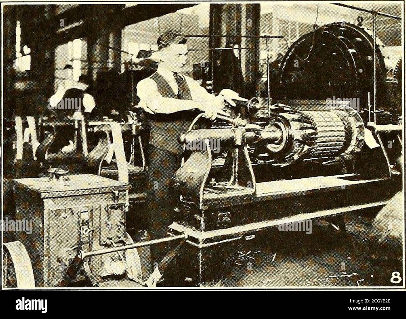 . Electric railway journal . commutator neck. Themica at the front V is protected with insulatingmaterial which receives a special treatment of varnishbefore baking. The commutators are then placed on theassembled core which is mounted in a 60-ton hydraulicpress and forced in place, using a pressure of from 10to 12 tons in the case of a 40-hp. motor. After being wound in metal-reinforced molds andDartly insulated the armature coils are heated in anoven and while hot pressed to a definite size. Theyare then taped, dipped in a high-grade insulating var-nish and baked. The dipping and baking are Stock Photo