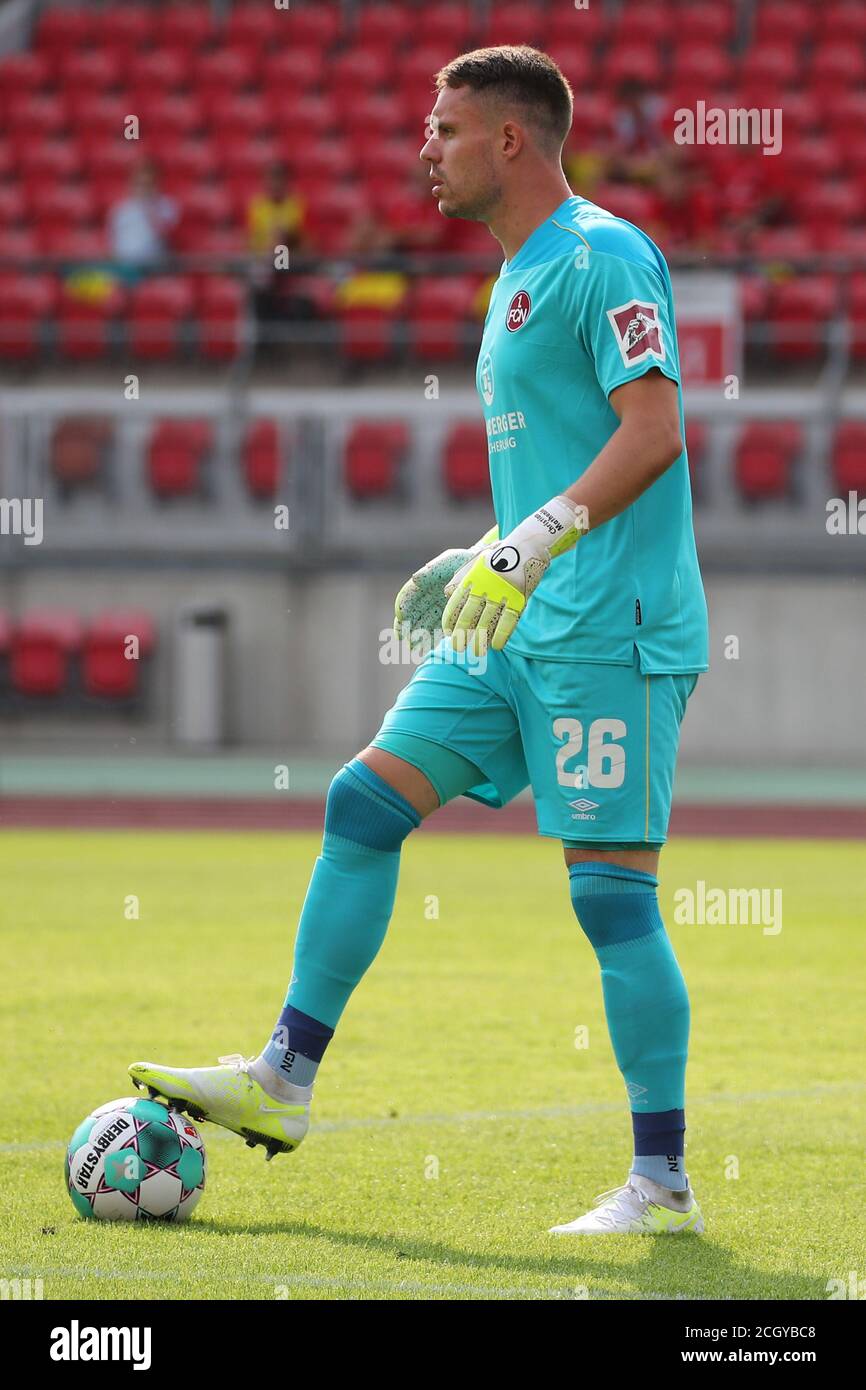 Nuremberg, Germany. 12th Sep, 2020. Football: DFB Cup, 1st FC Nuremberg - RB Leipzig, 1st round. The Nuremberg goalkeeper Christian Mathenia plays the ball. Credit: Daniel Karmann/dpa - IMPORTANT NOTE: In accordance with the regulations of the DFL Deutsche Fußball Liga and the DFB Deutscher Fußball-Bund, it is prohibited to exploit or have exploited in the stadium and/or from the game taken photographs in the form of sequence images and/or video-like photo series./dpa/Alamy Live News Stock Photo