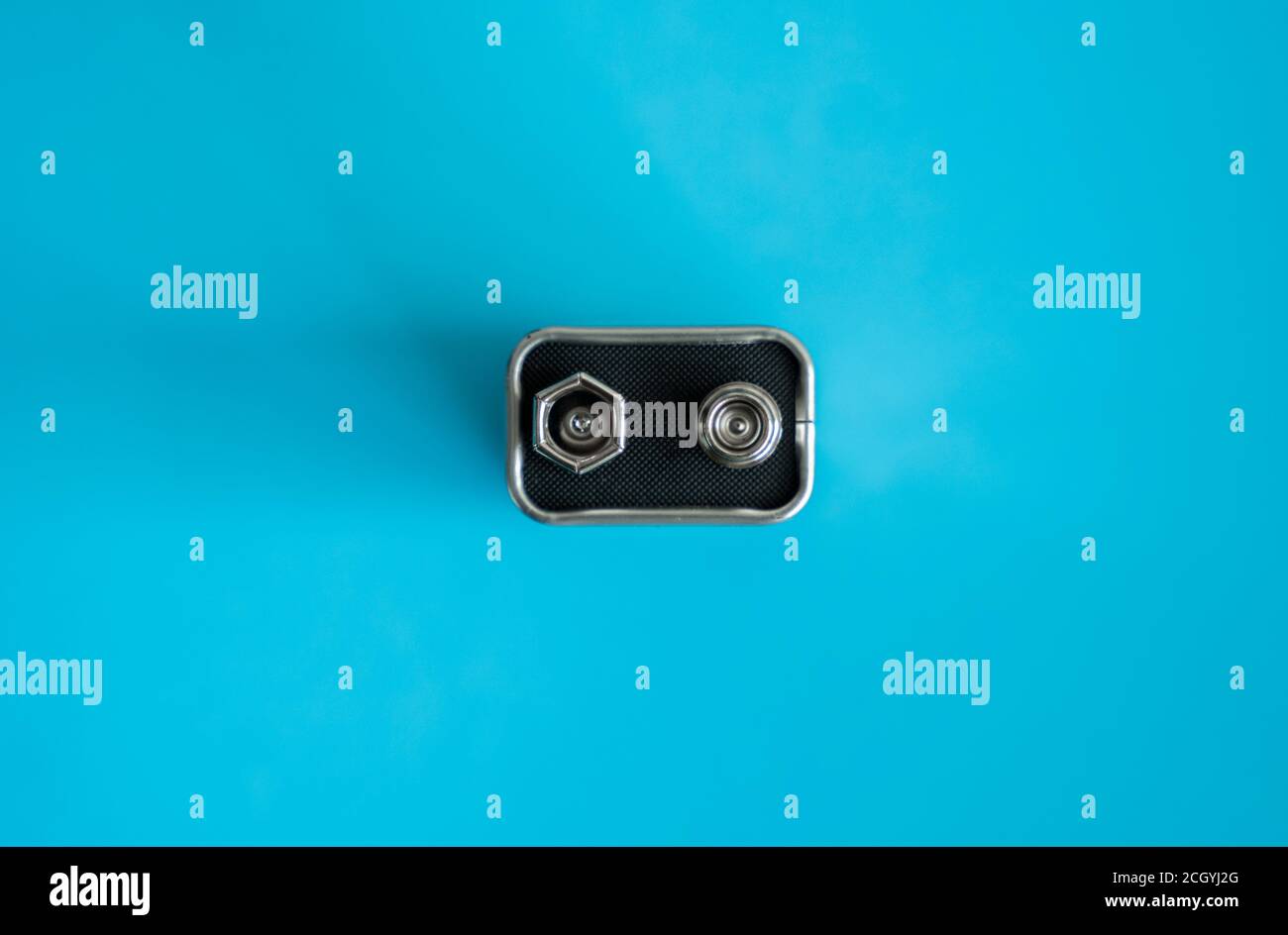 High voltage battery on a blue background. Silver Volt battery. 9V Advanced Lithium Batteries