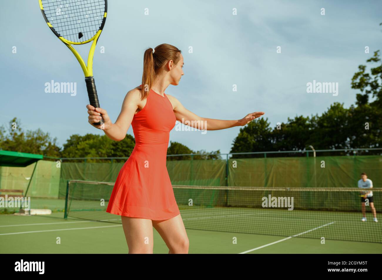 Tennis players, training on outdoor court Stock Photo Alamy