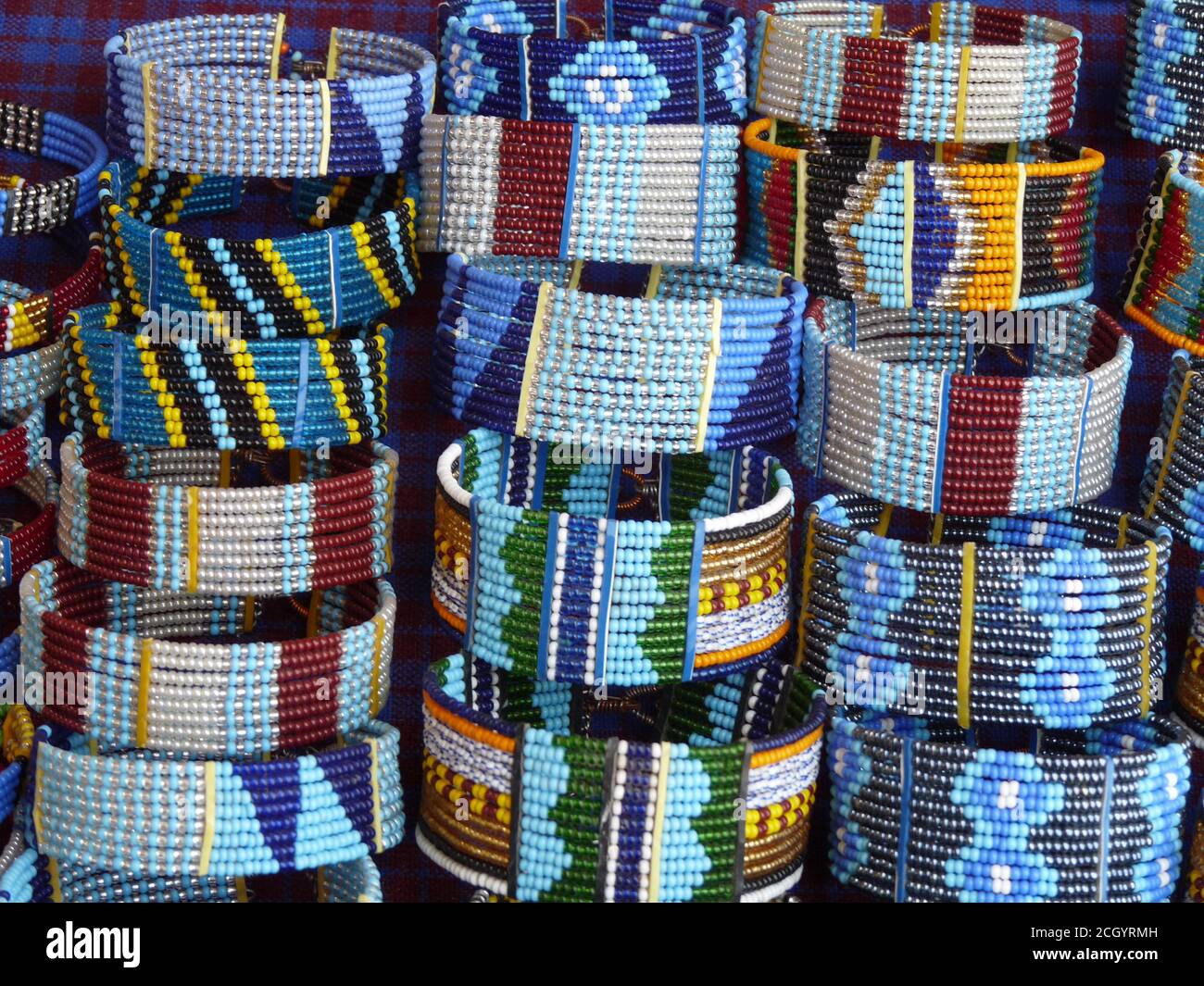 Close up display of colourful handmade Masai bracelets on sale, Kenya Stock Photo